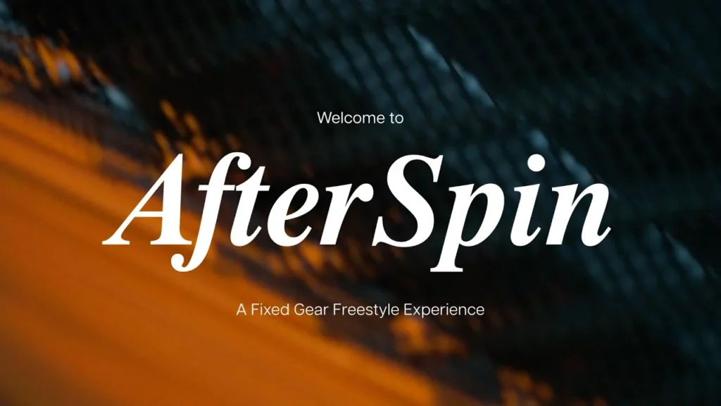 AfterSpin’s original trailer title against an abstract orange and dark blue photographic background