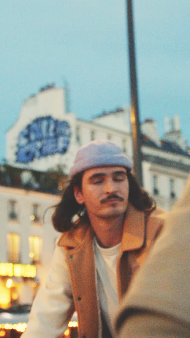 El Fakijoe wearing a grey Béton Ciré hat in the Paris campaign film