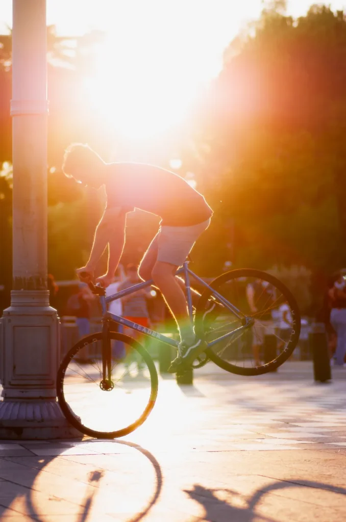 Sunlight flaring through a fixed gear freestyle session