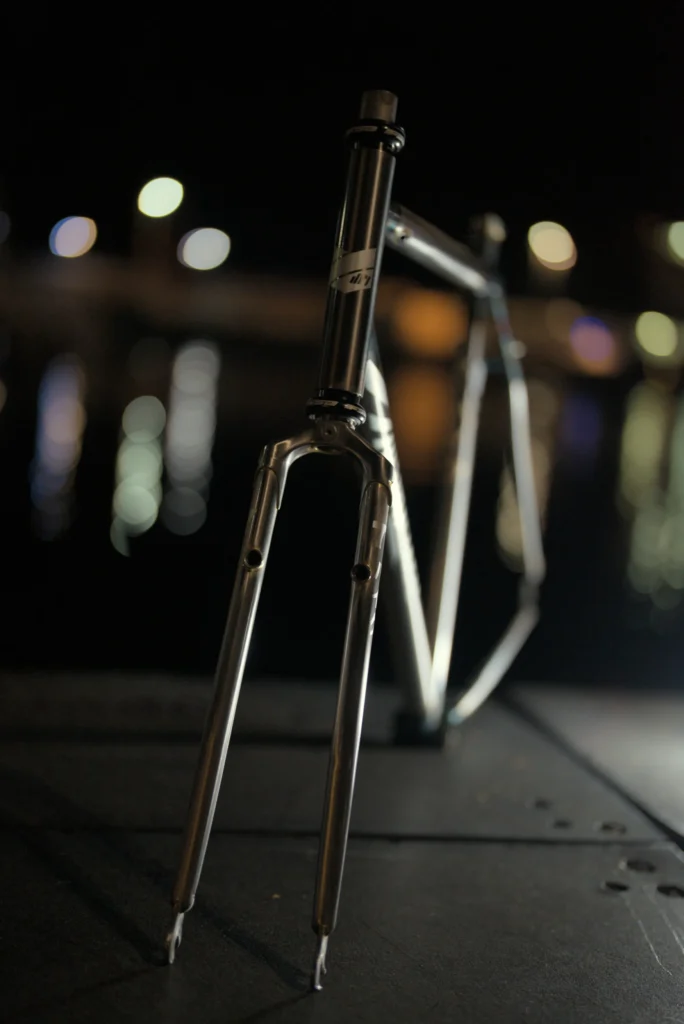 JRI Grit frame photographed against city lights